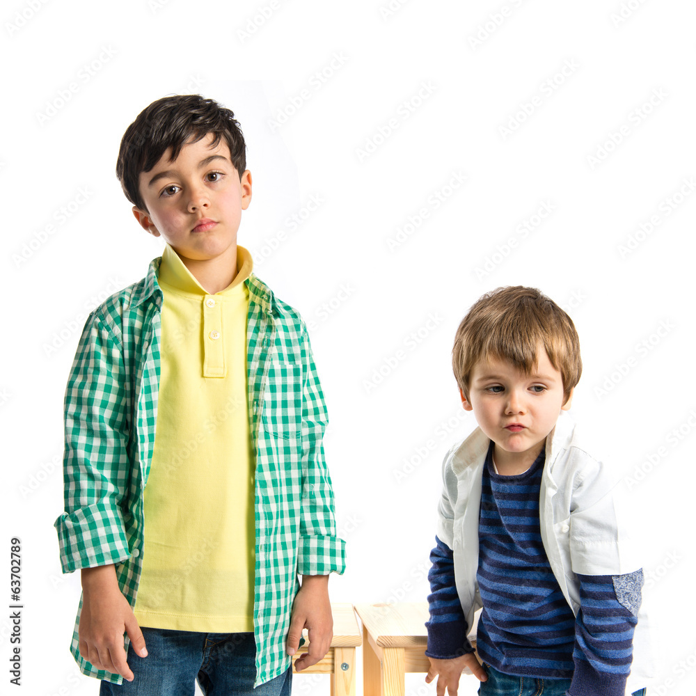 Two kids over white background