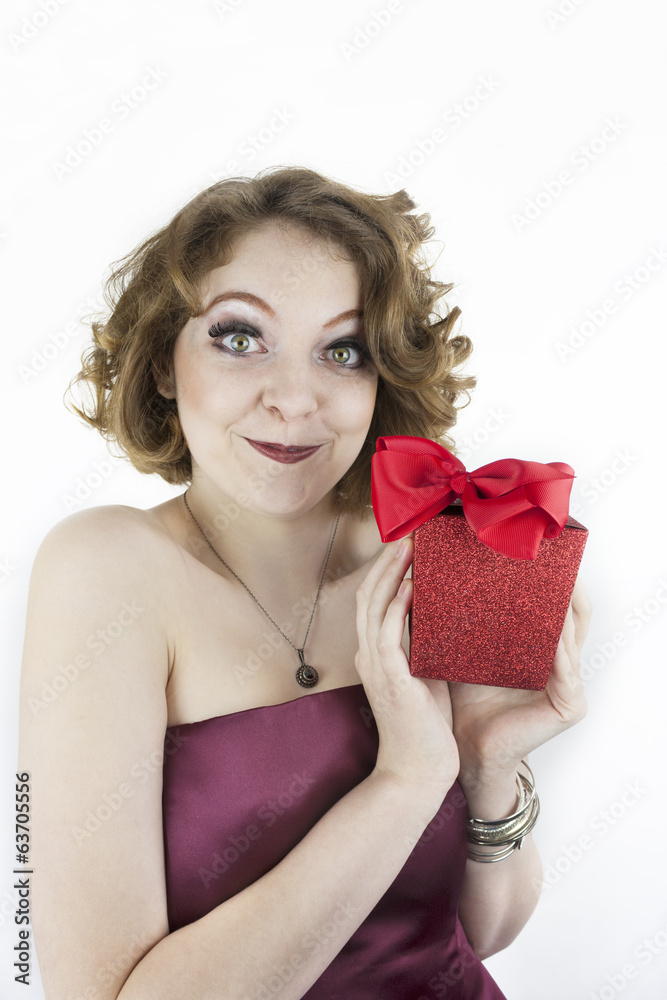 Cute young woman holding gift Cute young woman holding gift