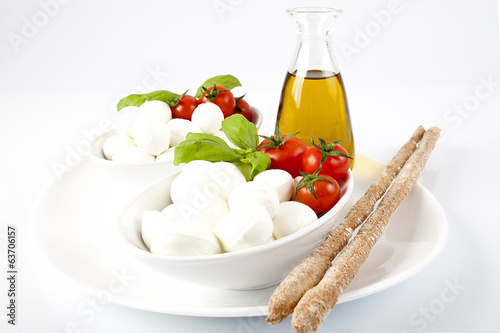 Prodotti tipici italiani;mozzarella,pomodoro e grissini photo
