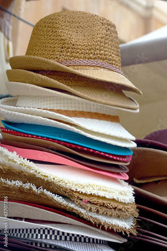 Hats are stacked for sale at the market