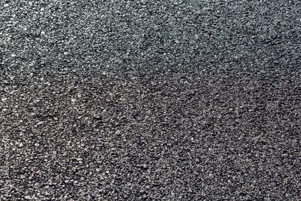 close-up horizontal view of new asphalt road close-up horizontal view of new asphalt road