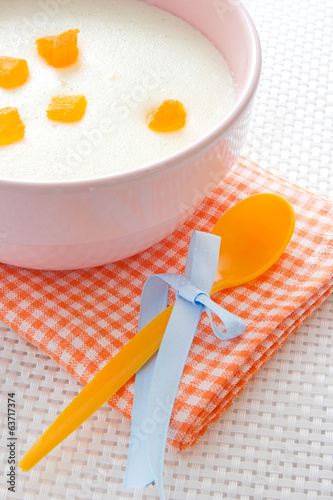 Baby food.Kid milk porridge with fruits. photo