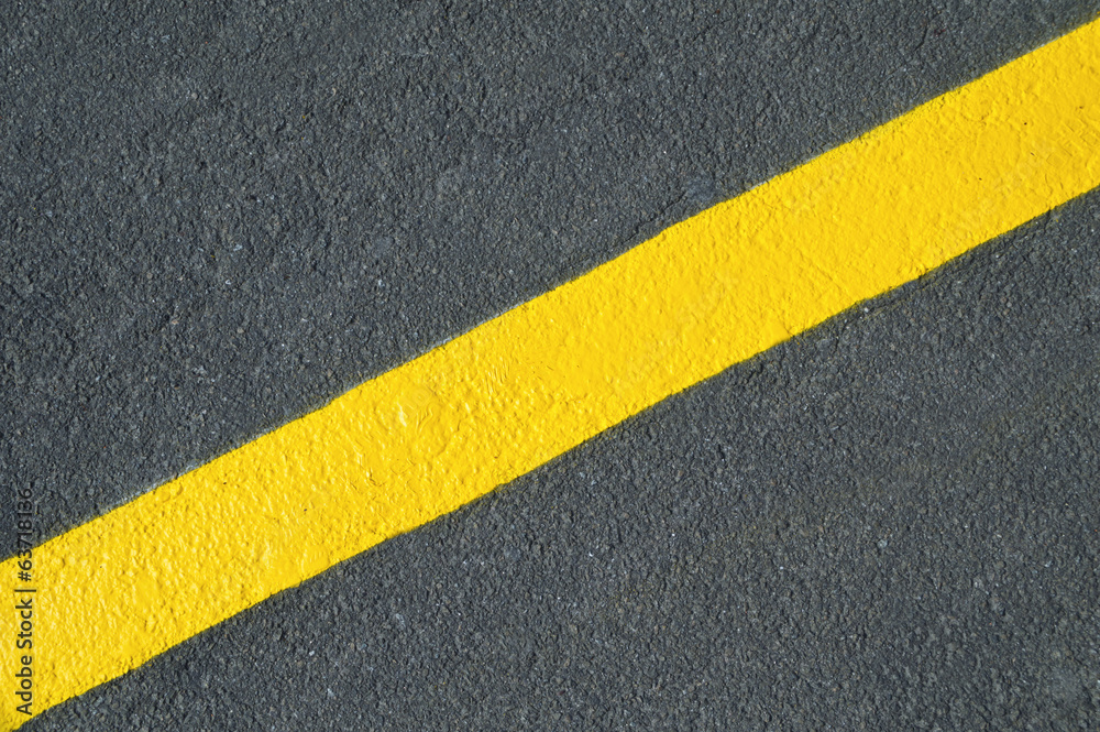 Yellow line on new asphalt detail