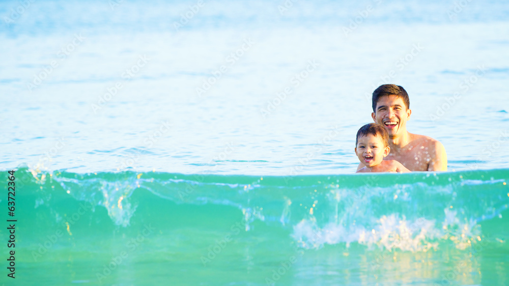 happy father and son in tropical sea, family beach vacation