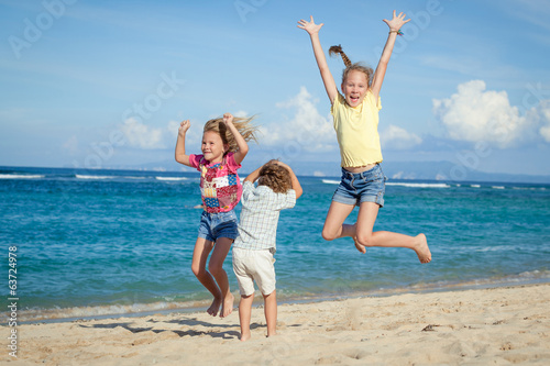 happy kids playing on beach