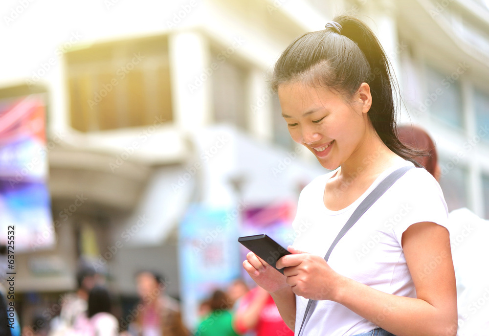 woman use smart phone at street