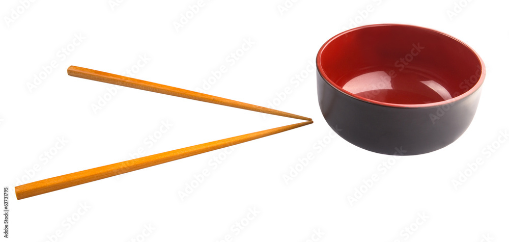 An empty bowl with a pair of chopsticks over white background An empty bowl with a pair of chopsticks over white background