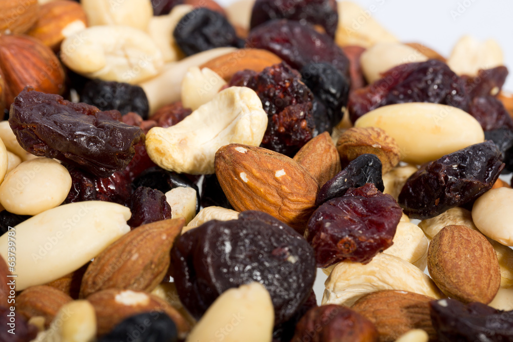mixed nuts and dried fruits isolated on white background mixed nuts and dried fruits isolated on white background