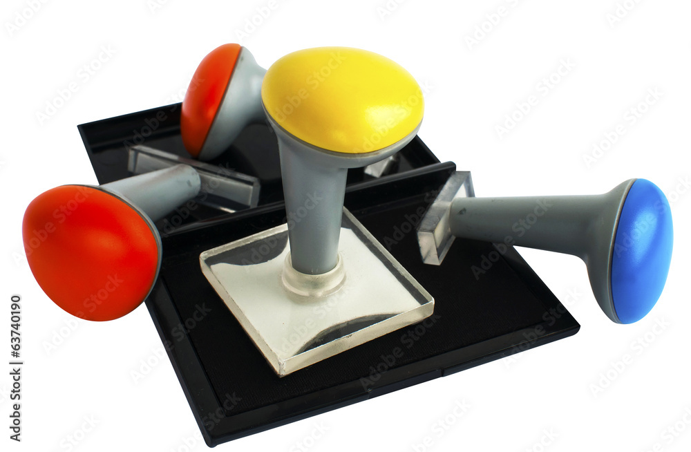 Plastic rubber stamps and inkpad isolated on white backgound Plastic rubber stamps and inkpad isolated on white backgound