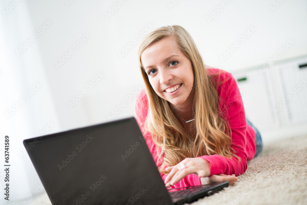 beautiful young woman websurfing at home beautiful young woman websurfing at home
