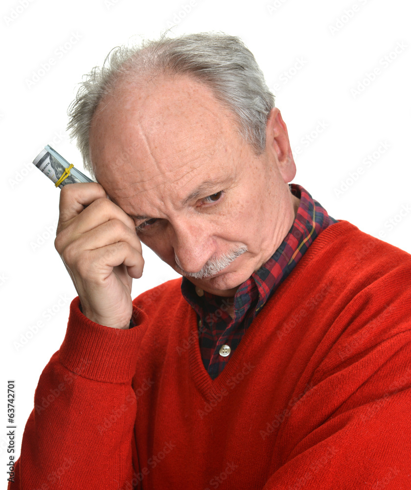 Elderly sad man with dollar bills Elderly sad man with dollar bills