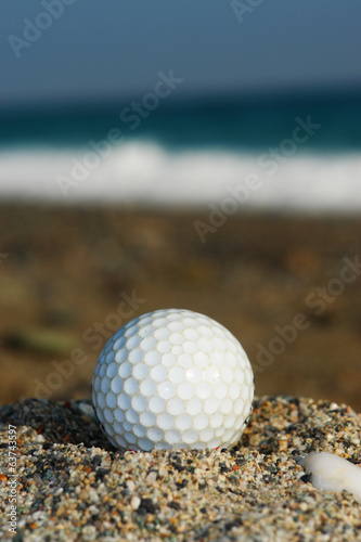 golfball im sand photo