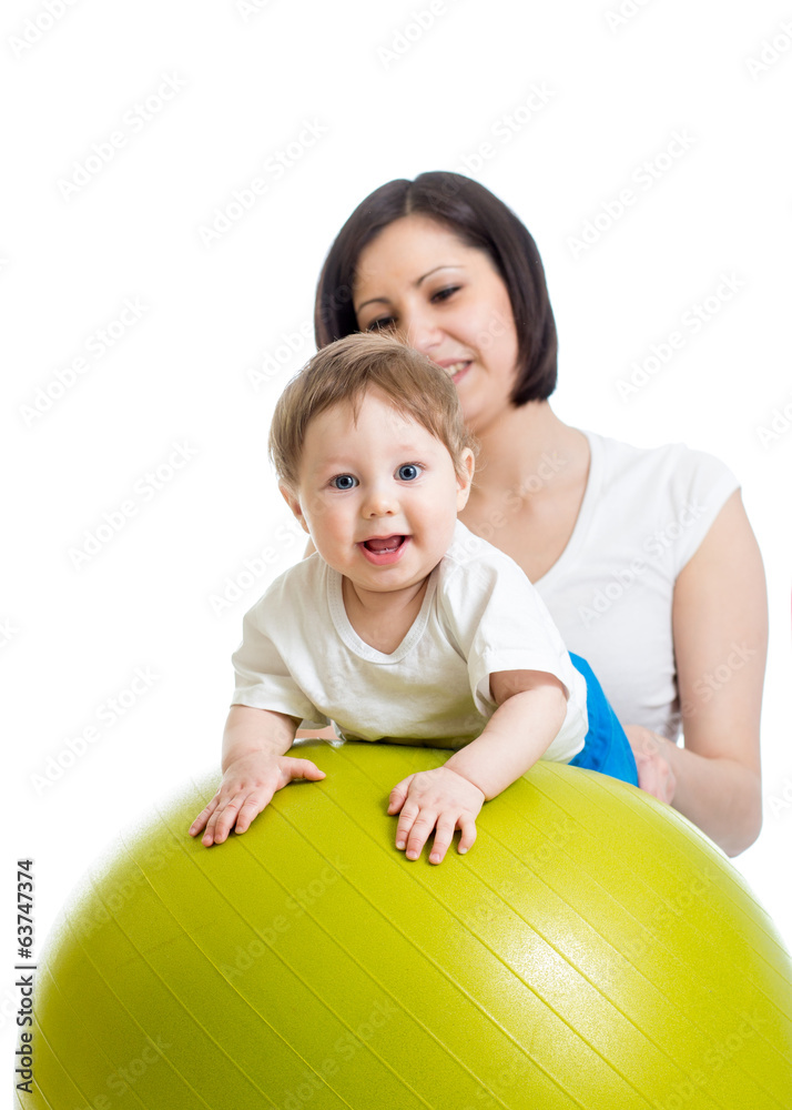 Fototapeta premium mother with baby having fun with gymnastic ball