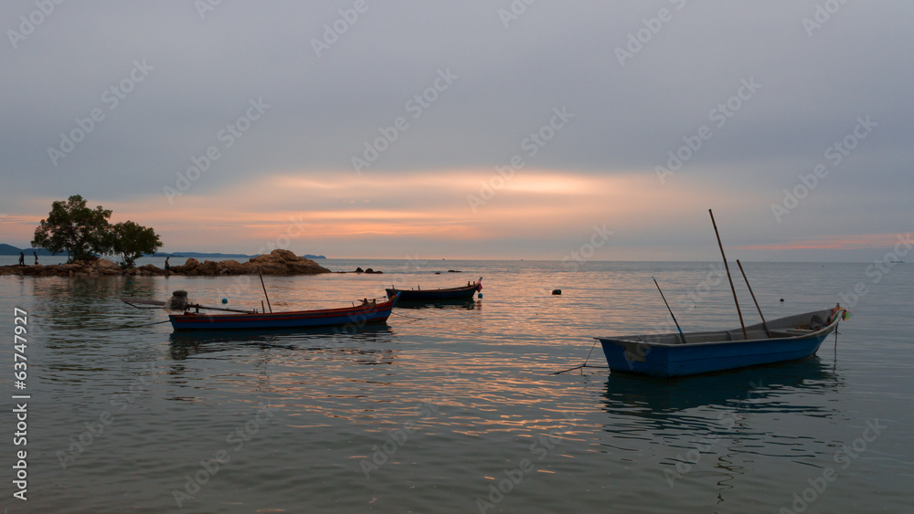 Evening. Fishing boats standing on the shore