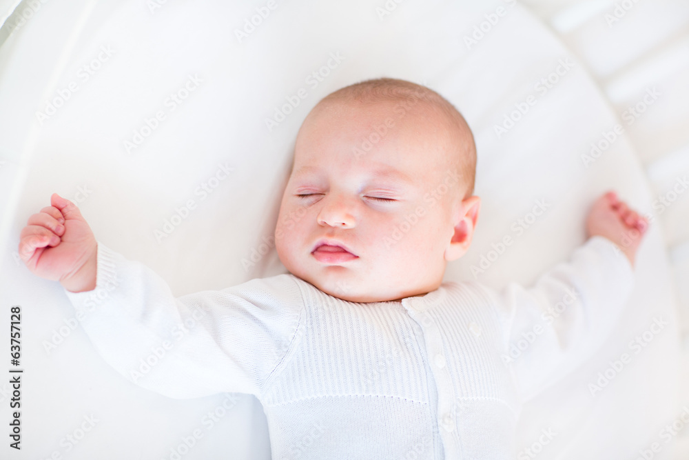 Little newborn baby boy sleeping in a white round crib Little newborn baby boy sleeping in a white round crib