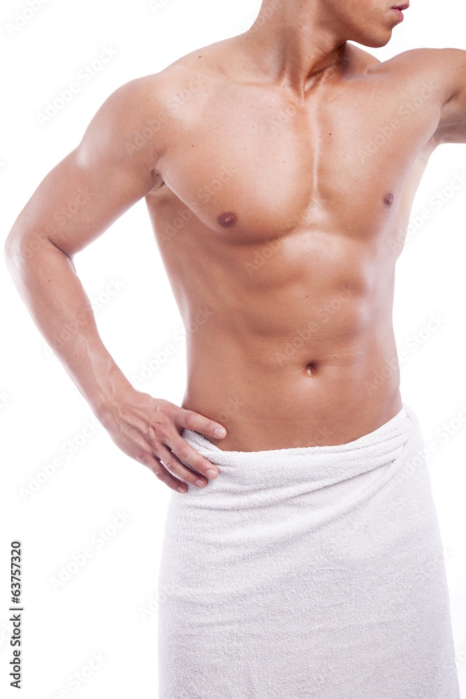 Muscular man in towel, isolated on white