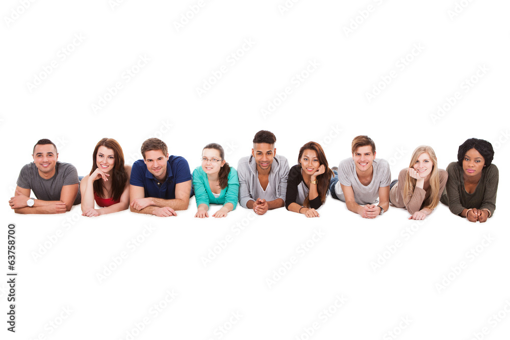 Students Lying In A Row Over White Background Students Lying In A Row Over White Background