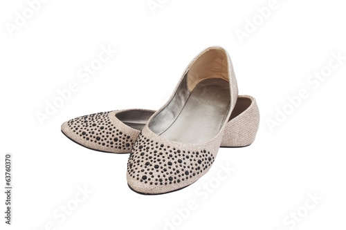 beige flat lady's shoes with black plastic jewelry