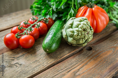 Variety of ripe vegetable produce on wooden table
