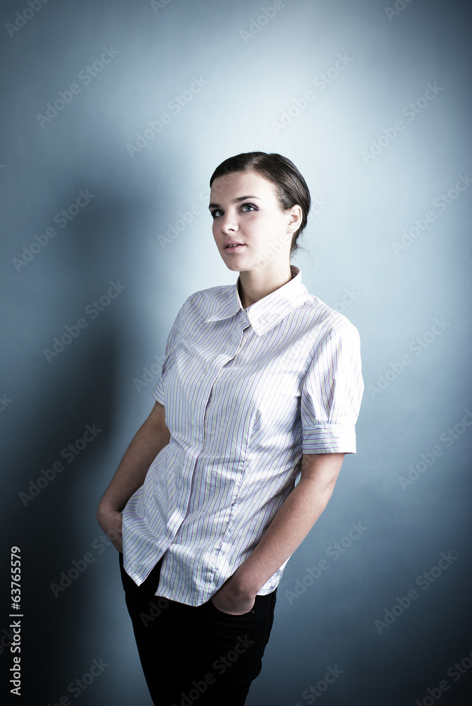 Young beautiful woman on gray background. Young beautiful woman on gray background.