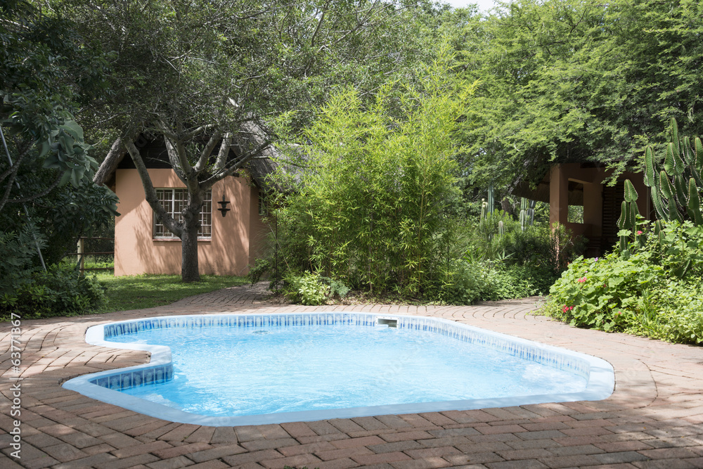 pool and small homes in nature