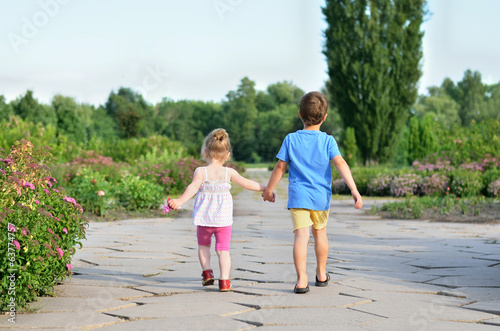 Children walking hand in hand © odenis83