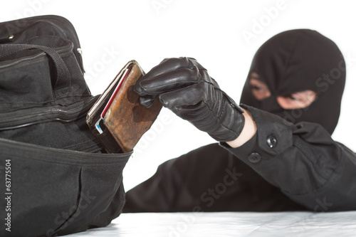 Thief stealing a wallet photo