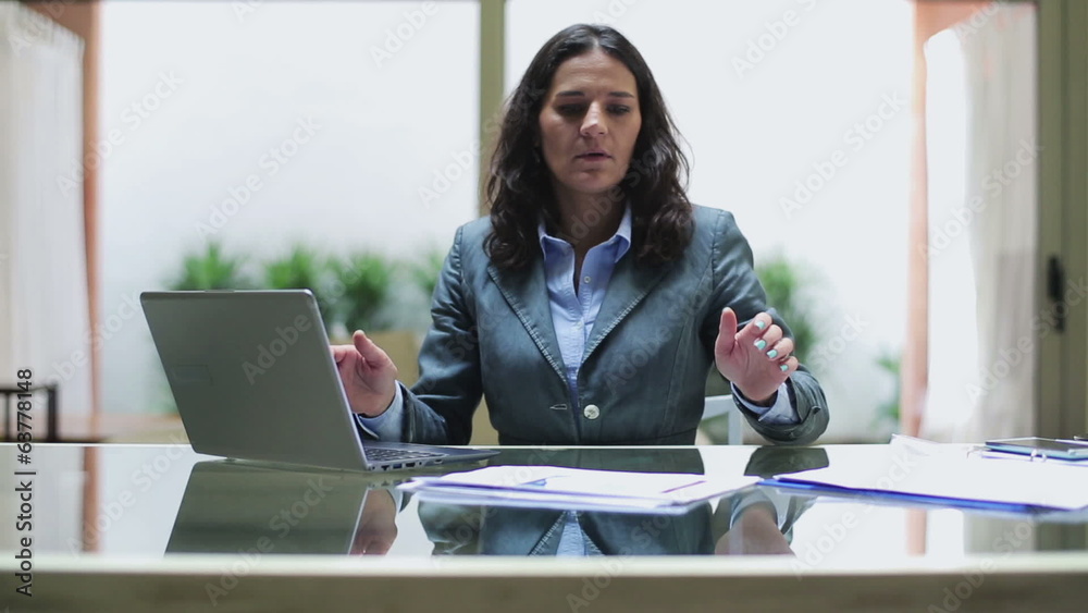 Businesswoman getting bad results in the office, steadycam shot Businesswoman getting bad results in the office, steadycam shot