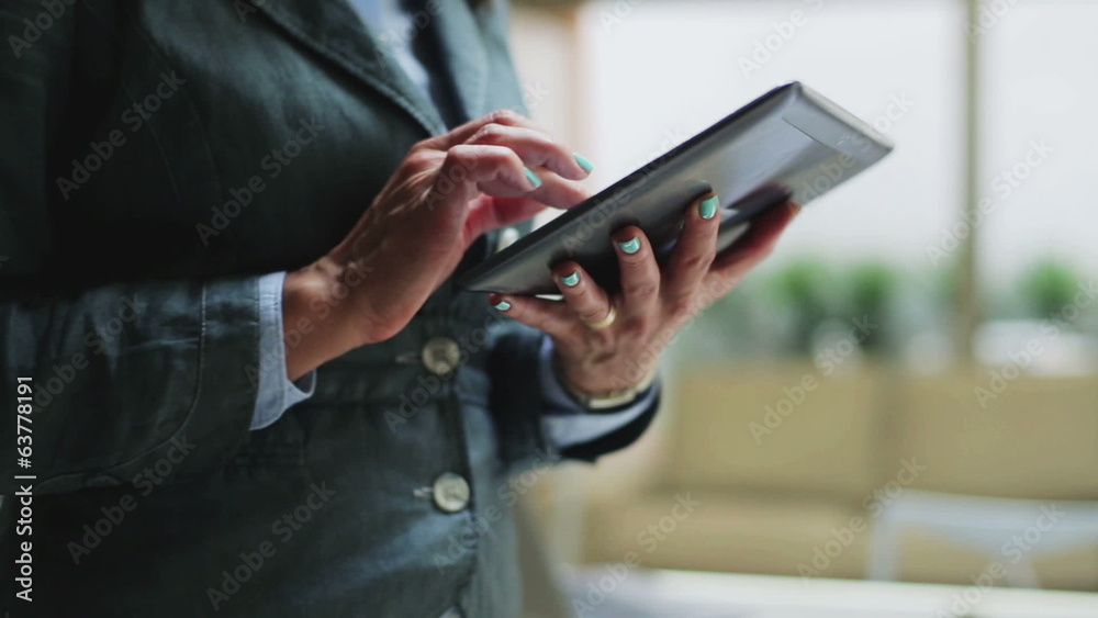 Businesswoman using tablet, closeup, steadycam shot