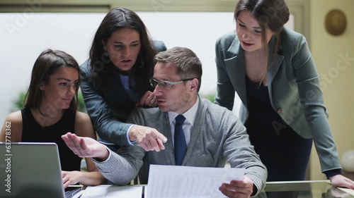 Businesspeople comparing results and arguing with each other