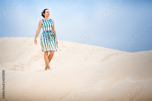 Woman on sand dune at Tarifa Andalusia in Spain