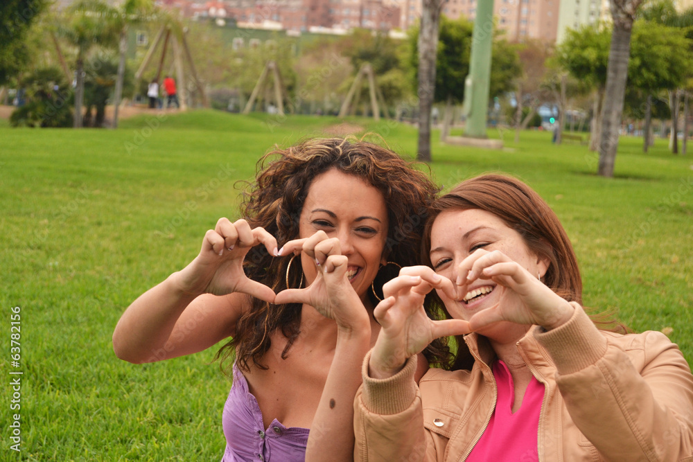 Fototapeta premium Two young women fun in park
