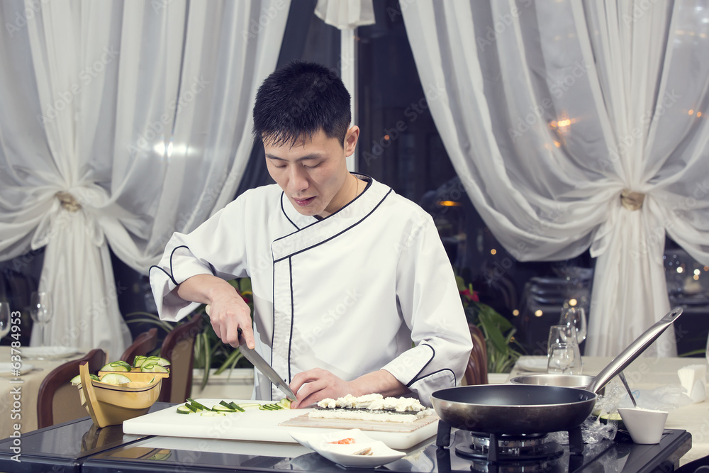 Japanese chef preparing a meal in a restaurant