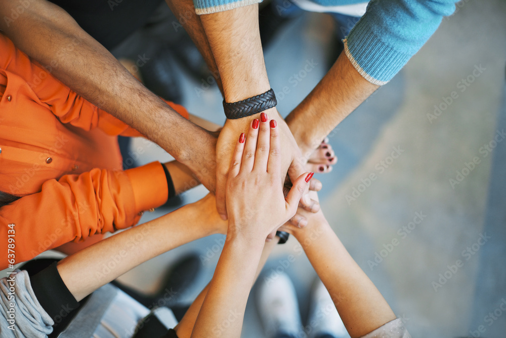 Stack of hands a symbol of teamwork Stack of hands a symbol of teamwork