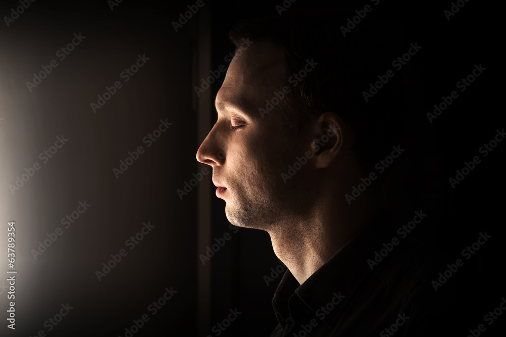Closeup profile portrait of young Caucasian man with closed eyes Closeup profile portrait of young Caucasian man with closed eyes