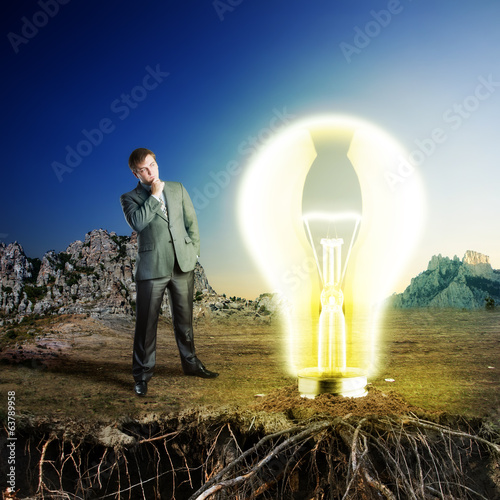 Businessman on the nature with big idea