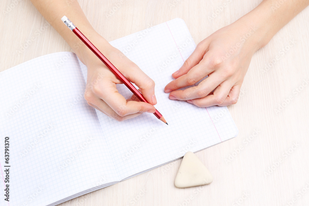 Human hands with pencil writing Human hands with pencil writing