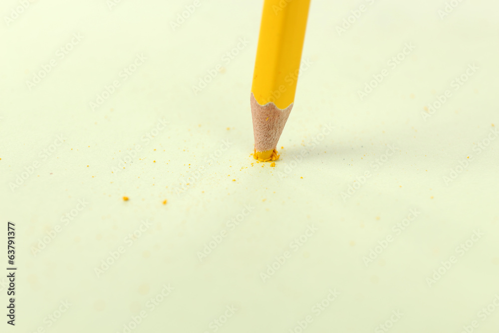Obraz premium Breaking pencil on paper, close up