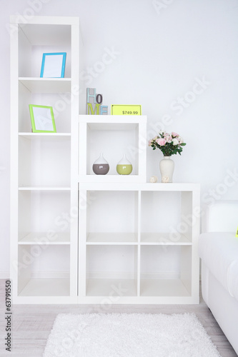New white furniture with price on light background © Africa Studio