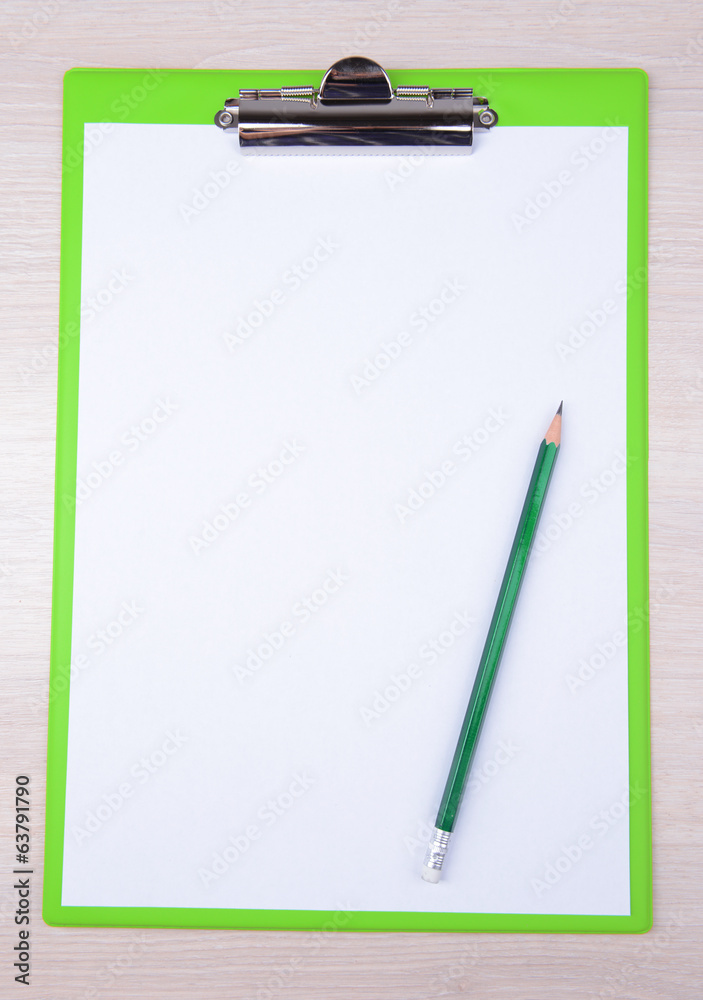 Clipboard on wooden background Clipboard on wooden background