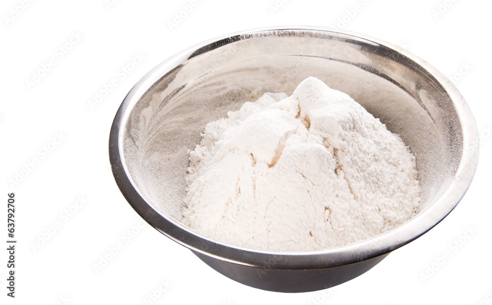 Flour in mixing steel mixing bowl.