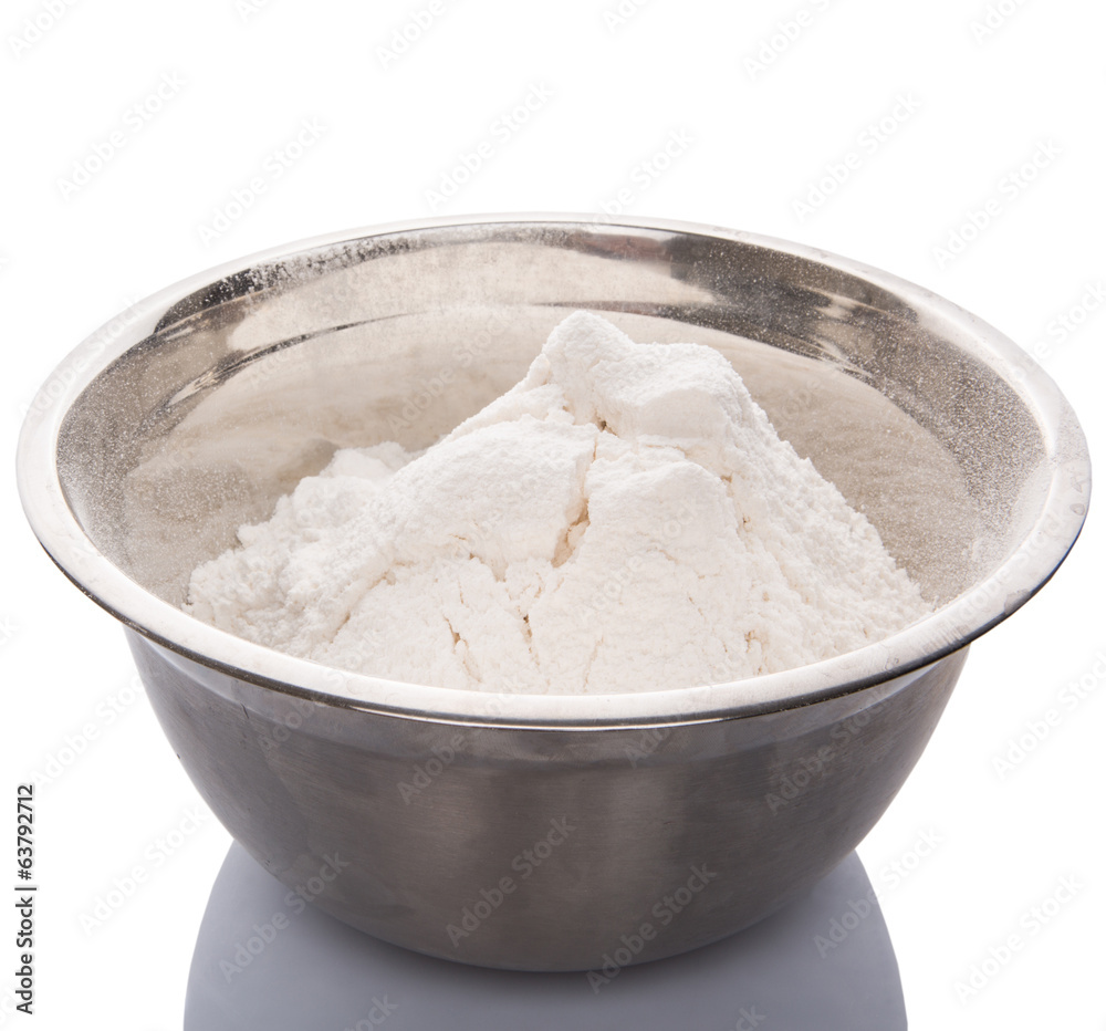 Flour in mixing steel mixing bowl.