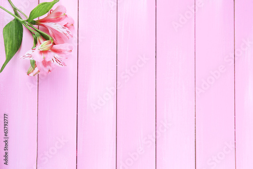 Fototapeta Naklejka Na Ścianę i Meble -  Beautiful Alstroemeria flowers on wooden table
