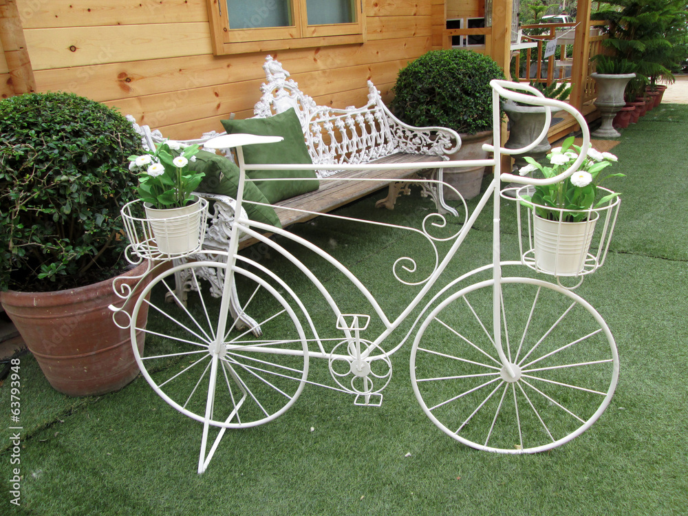 Vintage  of artificial flowers white and bicycle