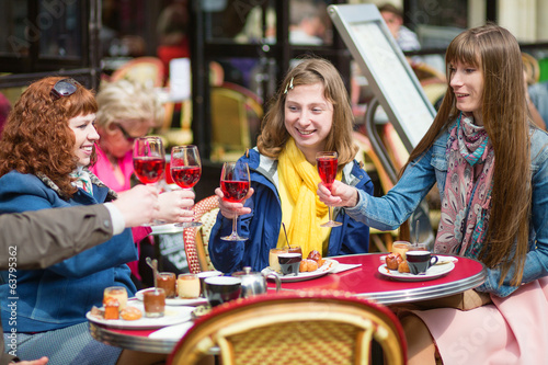 Beautiful girls in a Parisian cafe.