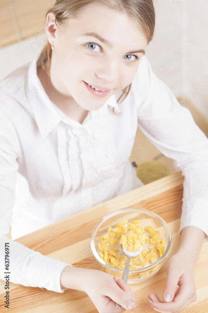 Little Caucasian Teenager Girl Having Cereal Breakfast Little Caucasian Teenager Girl Having Cereal Breakfast