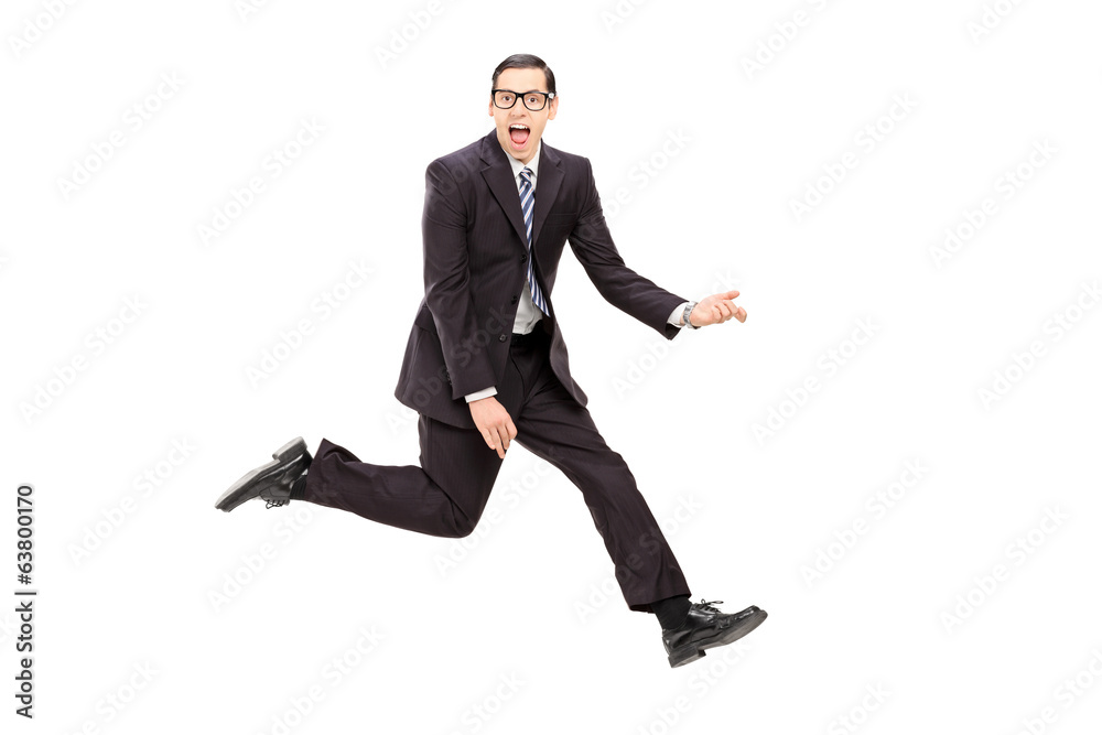 Man in suit playing air guitar Man in suit playing air guitar