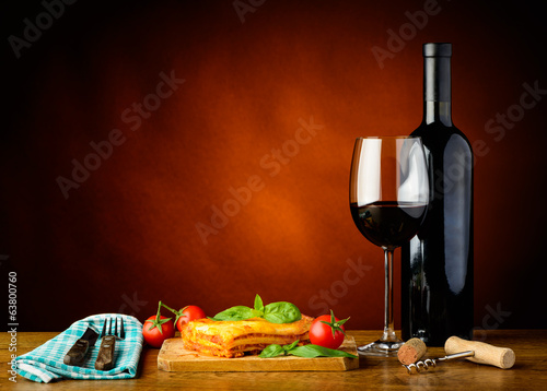 Fototapeta Naklejka Na Ścianę i Meble -  Traditional italian meal with lasagna and red wine