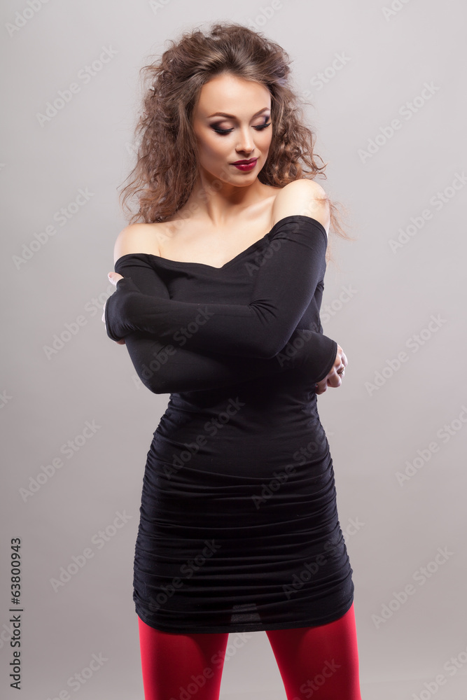 Girl in red socks studio shooting on grey background Girl in red socks studio shooting on grey background