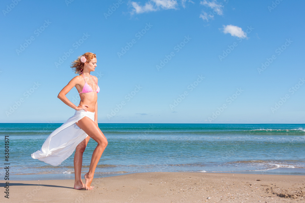 Young woman with white pants on the beach Young woman with white pants on the beach
